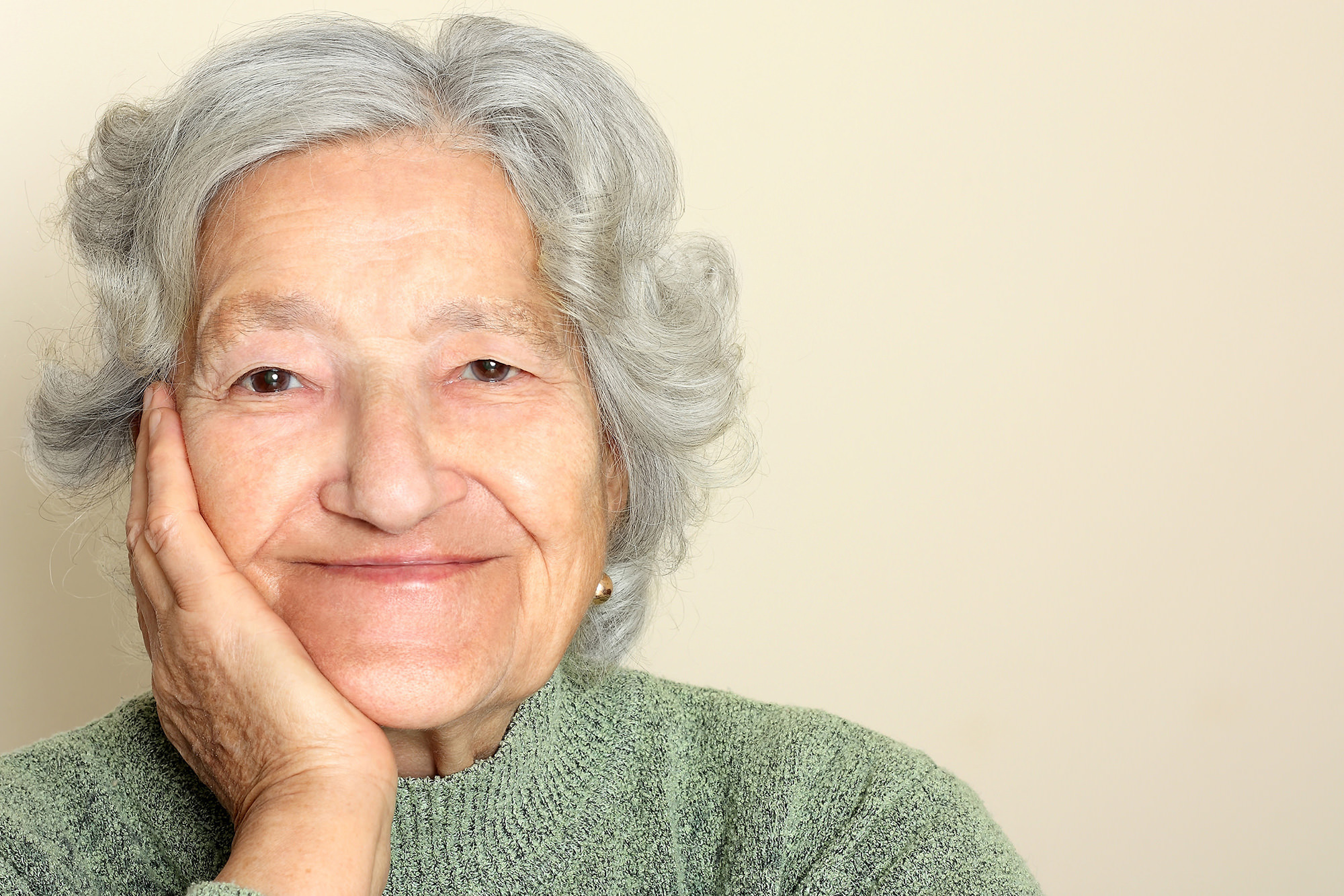 older woman smiling looking at camera