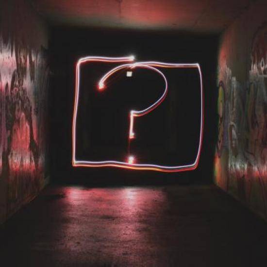 Photo of a neon question mark by Emily Morter on Unsplash