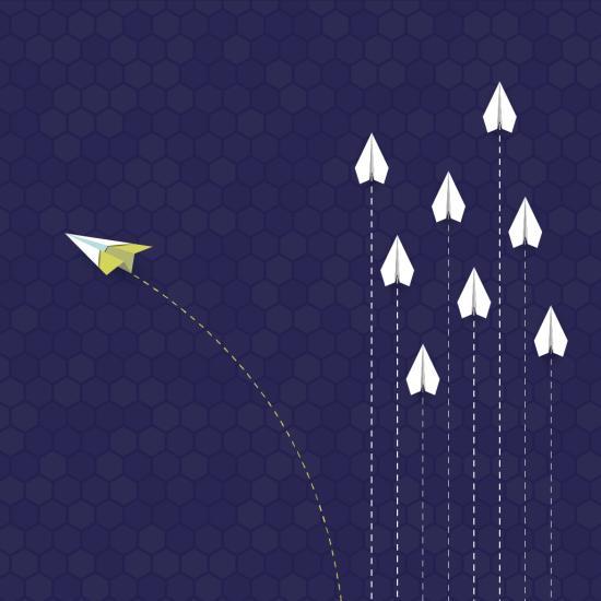Illustration of paper aeroplanes flying in formation with one breaking off representing change