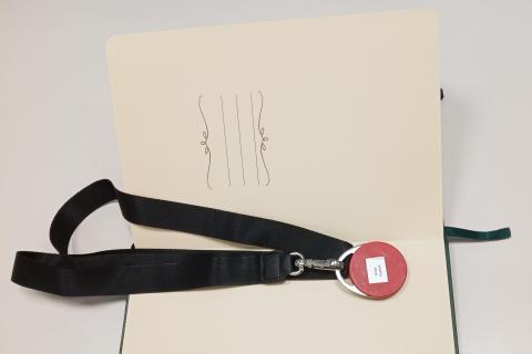 Paper notebook and Iriss guest key fob