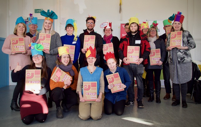 The group with hats and project planners