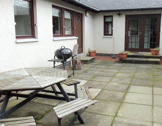 New social space with picnic bench, barbeque and plants