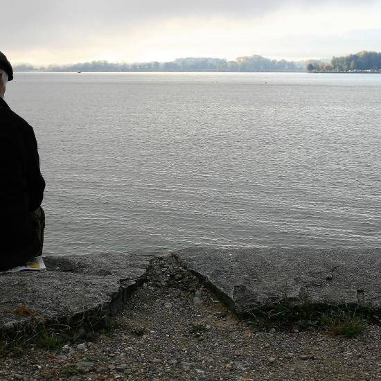 Older man looking out to sea