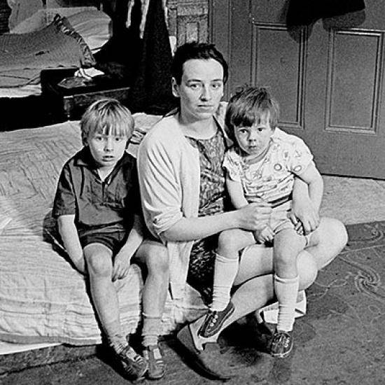 Mother living with her children in an overcrowded single end tenement flat Glasgow