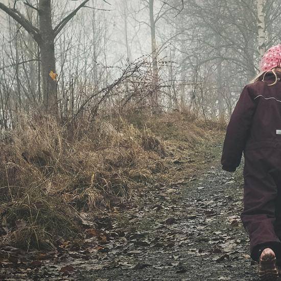 Child walking along a path