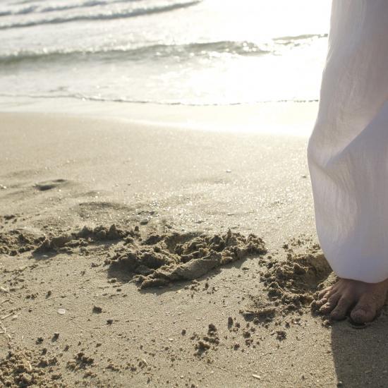 Person doing tai chi on a beach