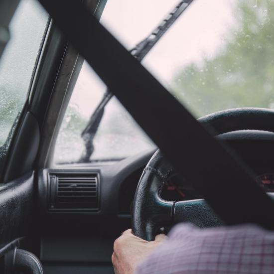 Person driving a car