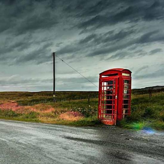 Red phone kiosk in rural location