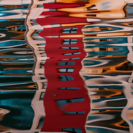 a water reflection of a colourful street