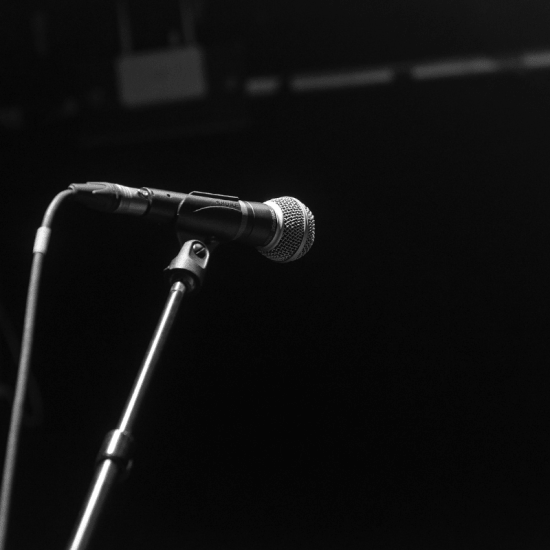 a dynamic microphone on a stand on a sound stage