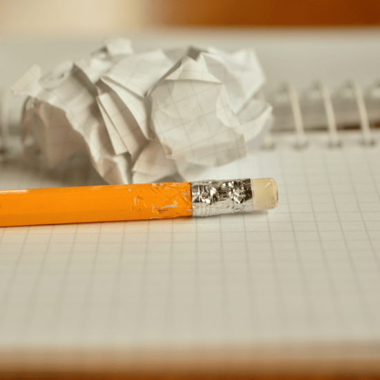 a pencil on an open notebook