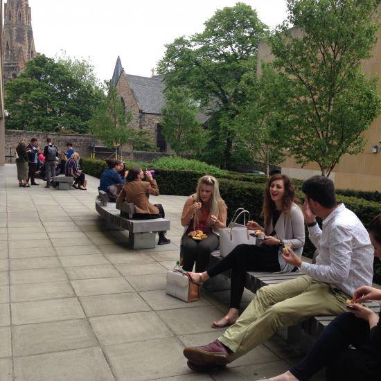 Students sitting having lunch outside