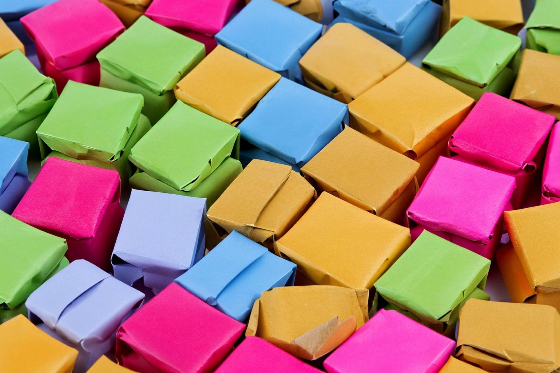 Jumble of small coloured cardboard boxes