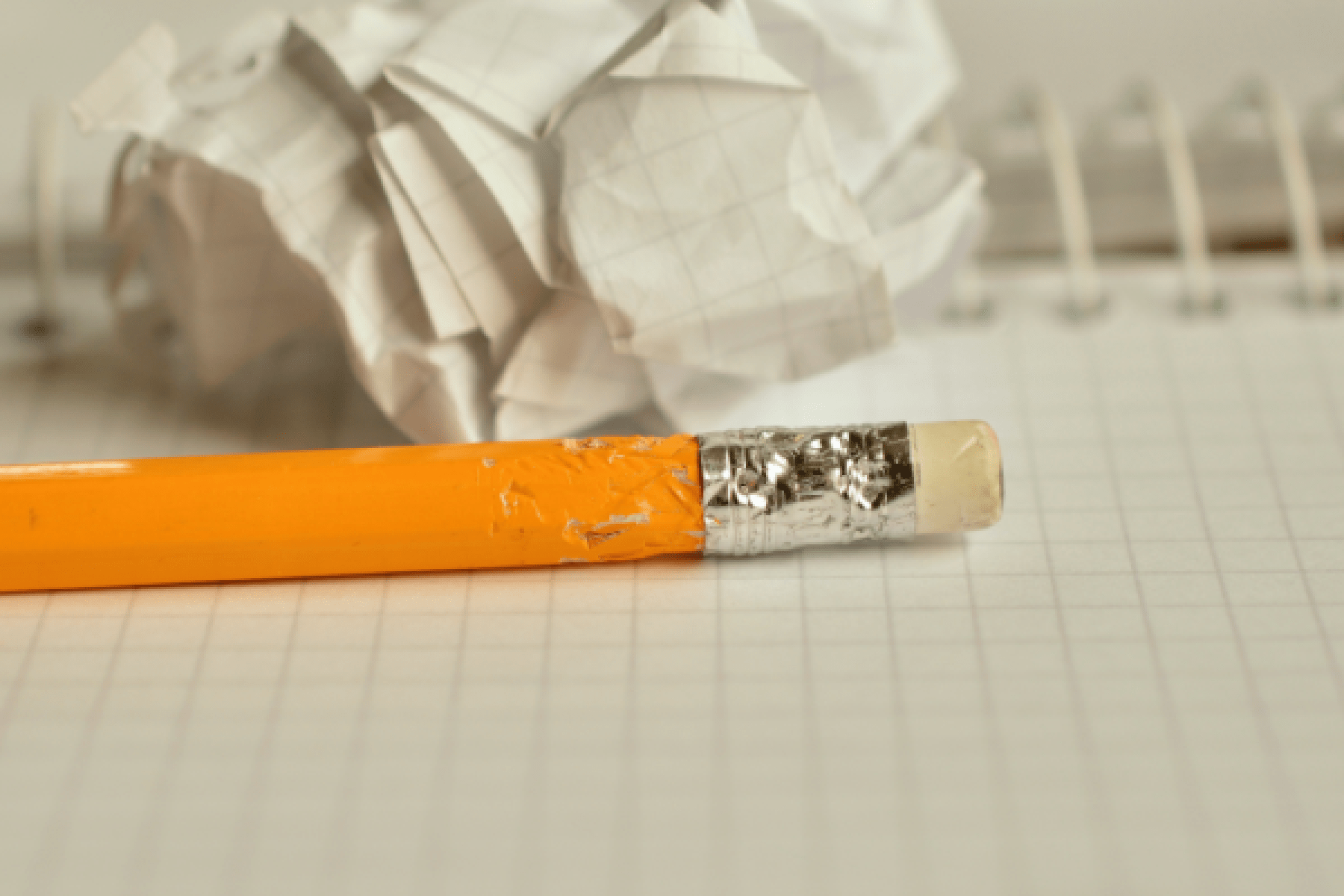a pencil on an open notebook