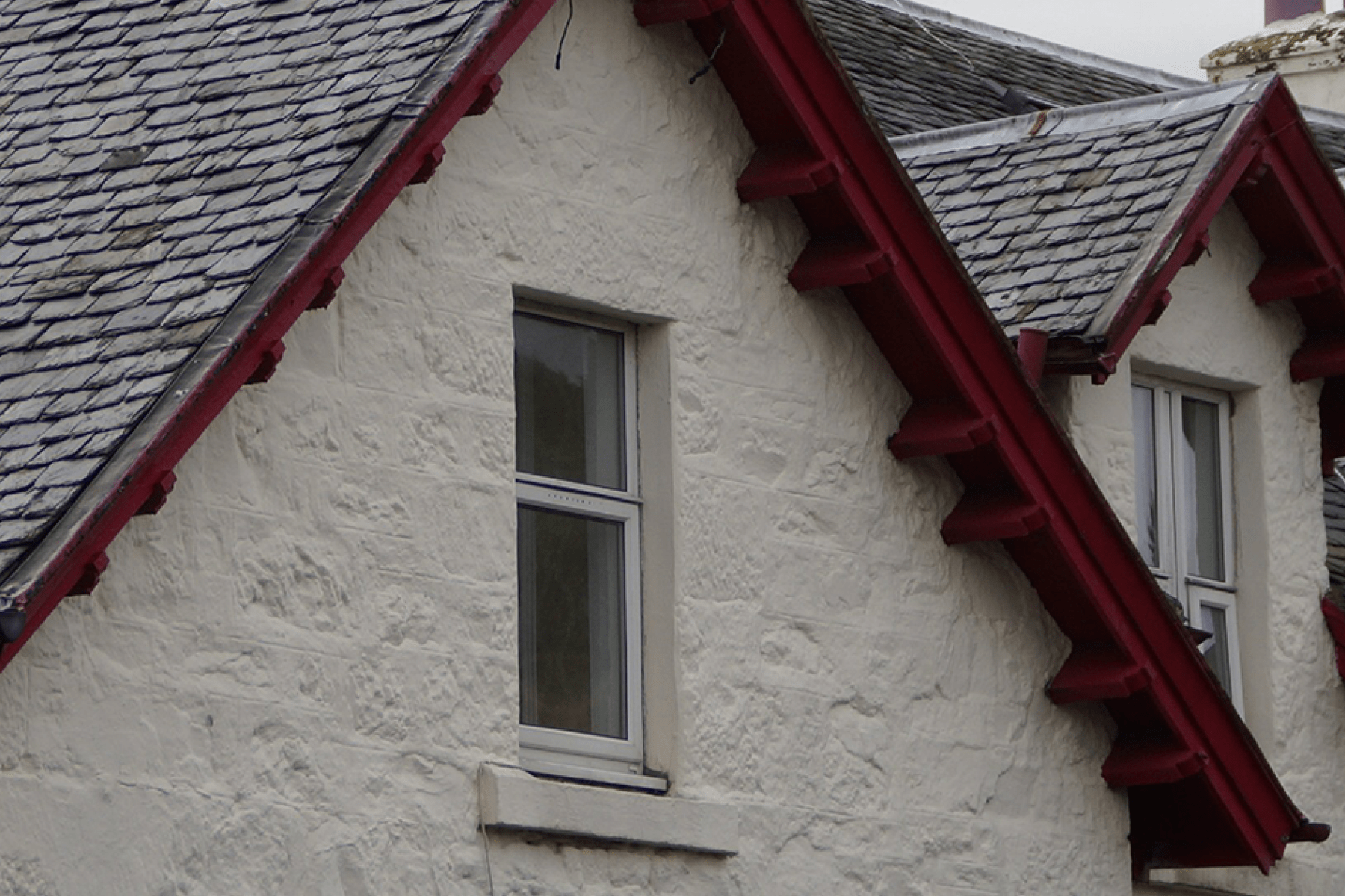 aa second story window with red lintel