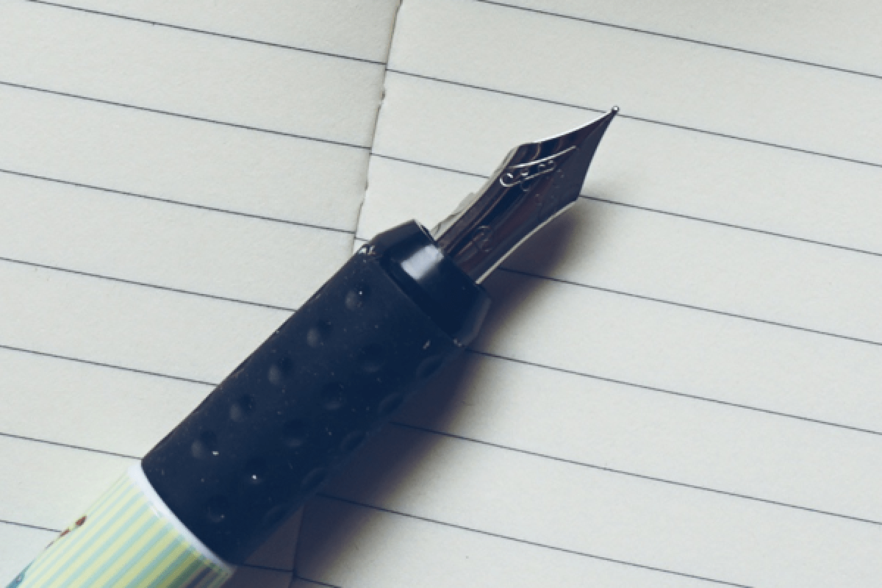 a pen on a notepad