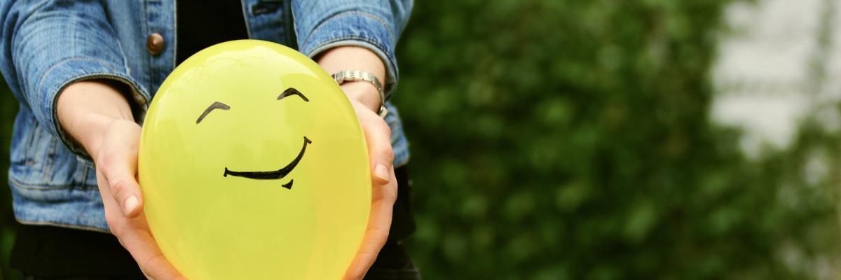 Yellow balloon with a smiley face
