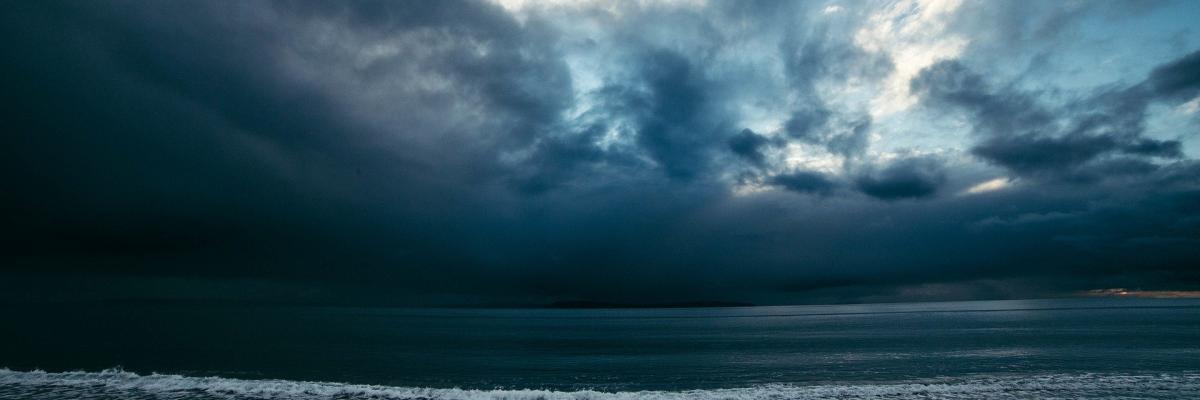 Beach at night with dark clouds