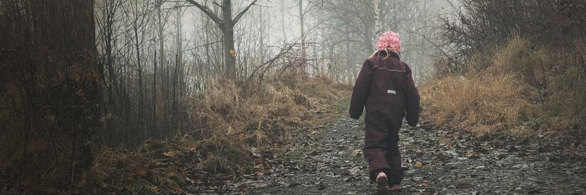 Child walking along a path