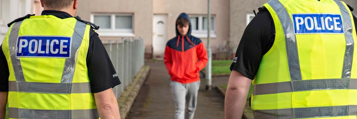 Child about to be arrested by two police officers