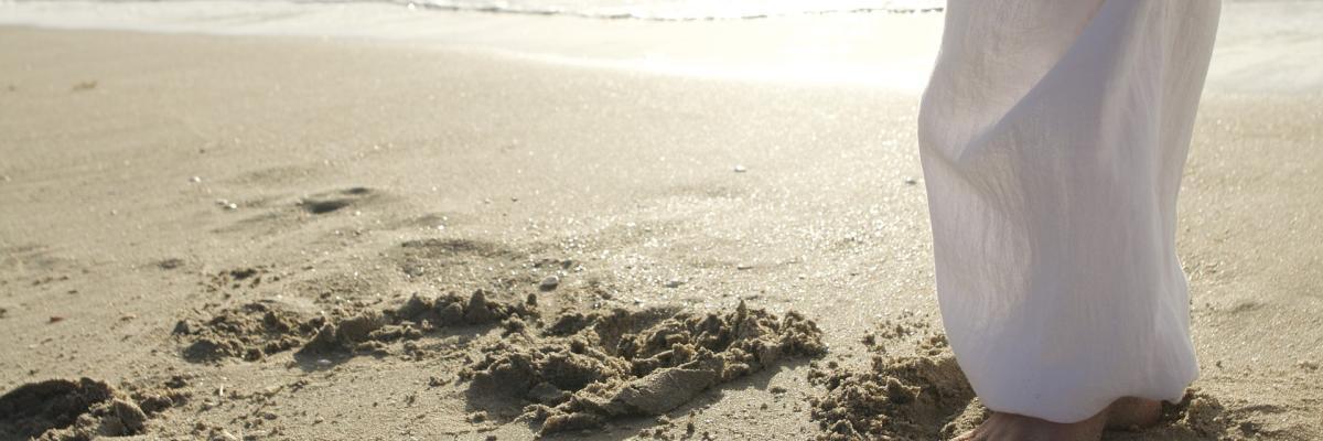 Person doing tai chi on a beach