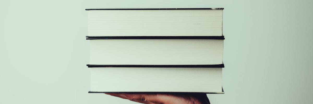 Pile of books in a hand