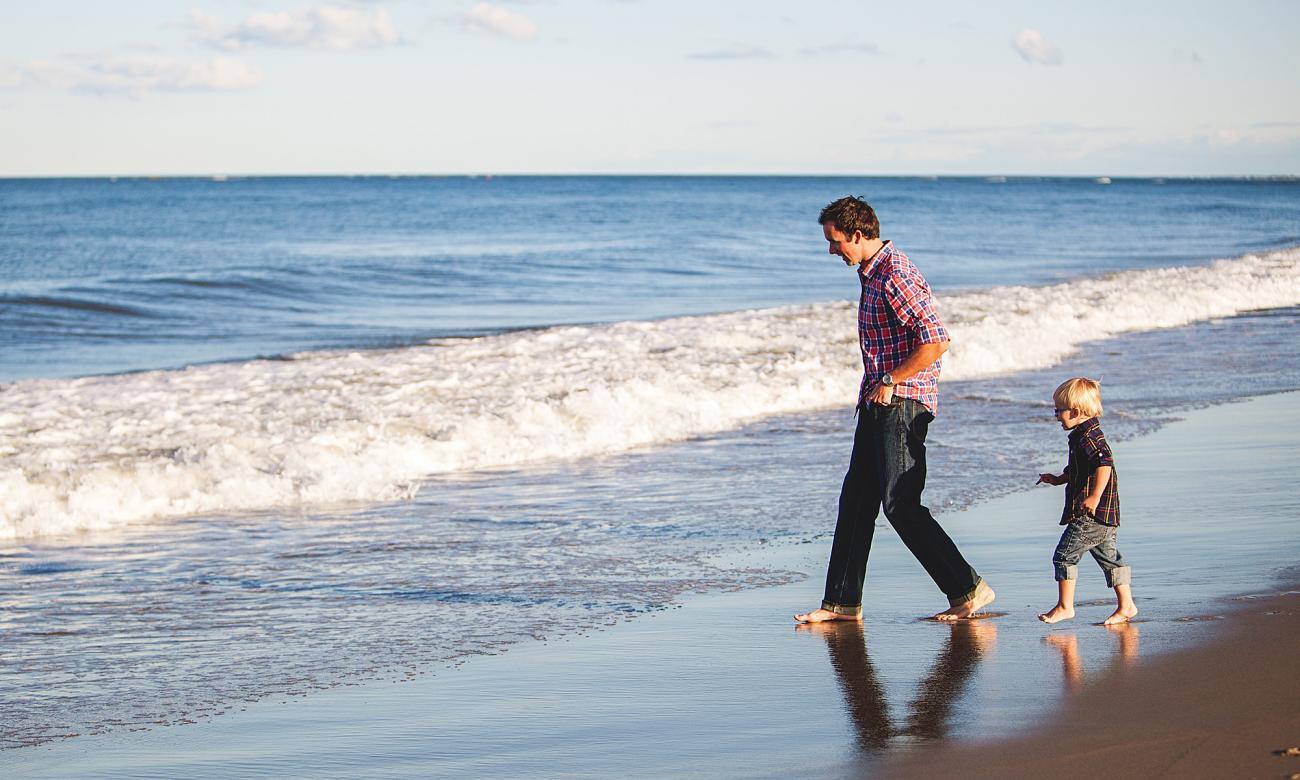 Father and son on beach