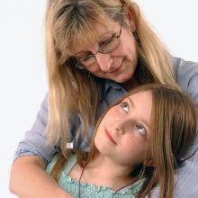 Woman and child in protective embrace