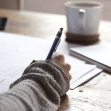 picture of person writing with a pen