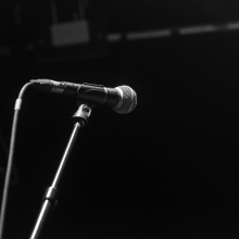 a dynamic microphone on a stand on a sound stage