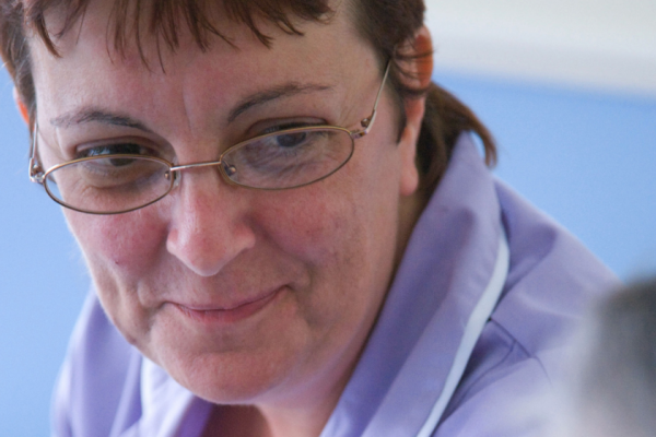 Image of care worker from the front of the guide