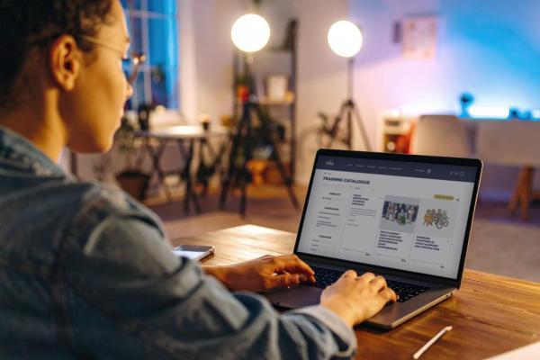 Young woman undertaking online learning course on laptop